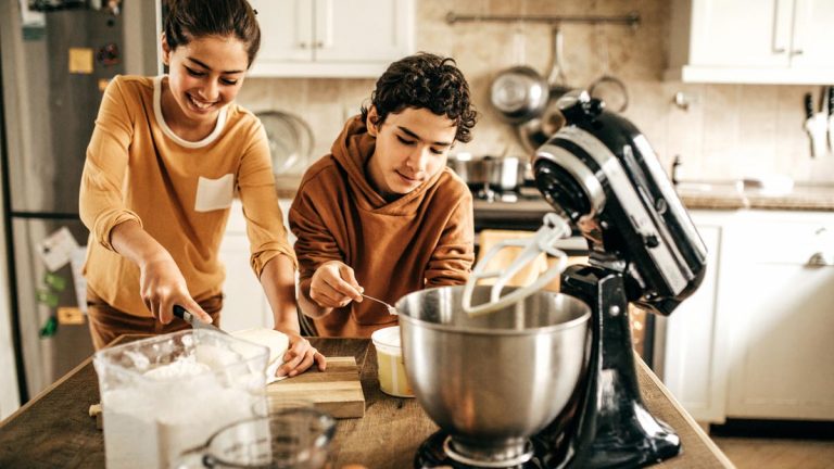 Teens cooking in a kitchen