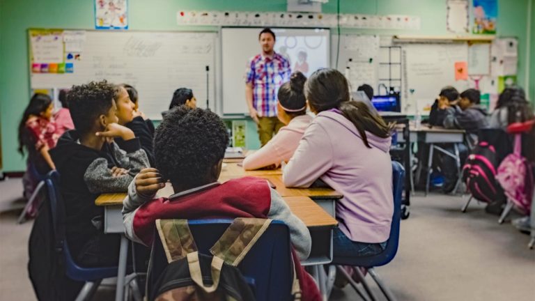 Teacher with students