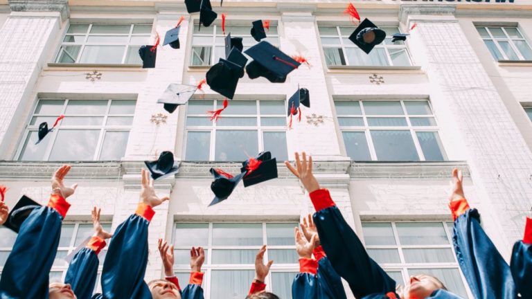 Graduates throw caps